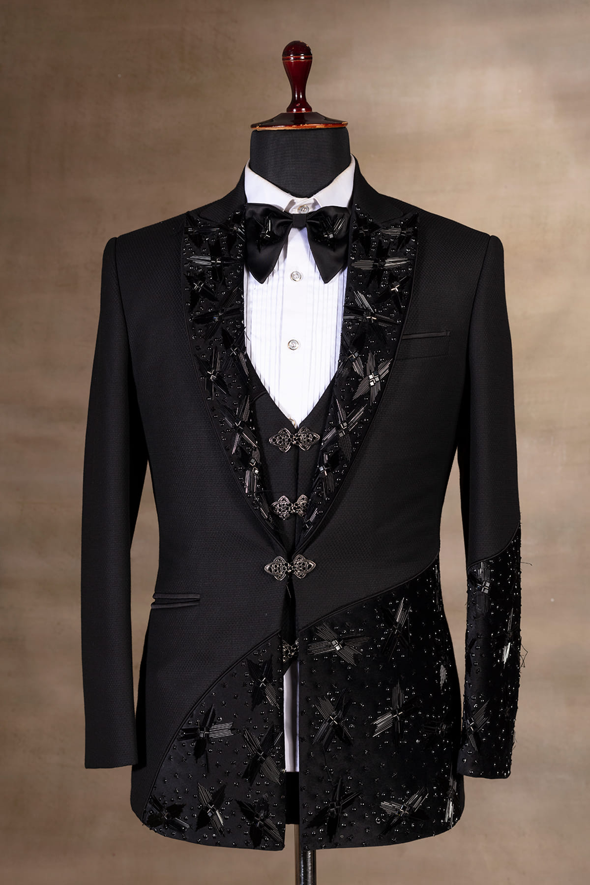 Black Suit adorned with intricate white embroidery