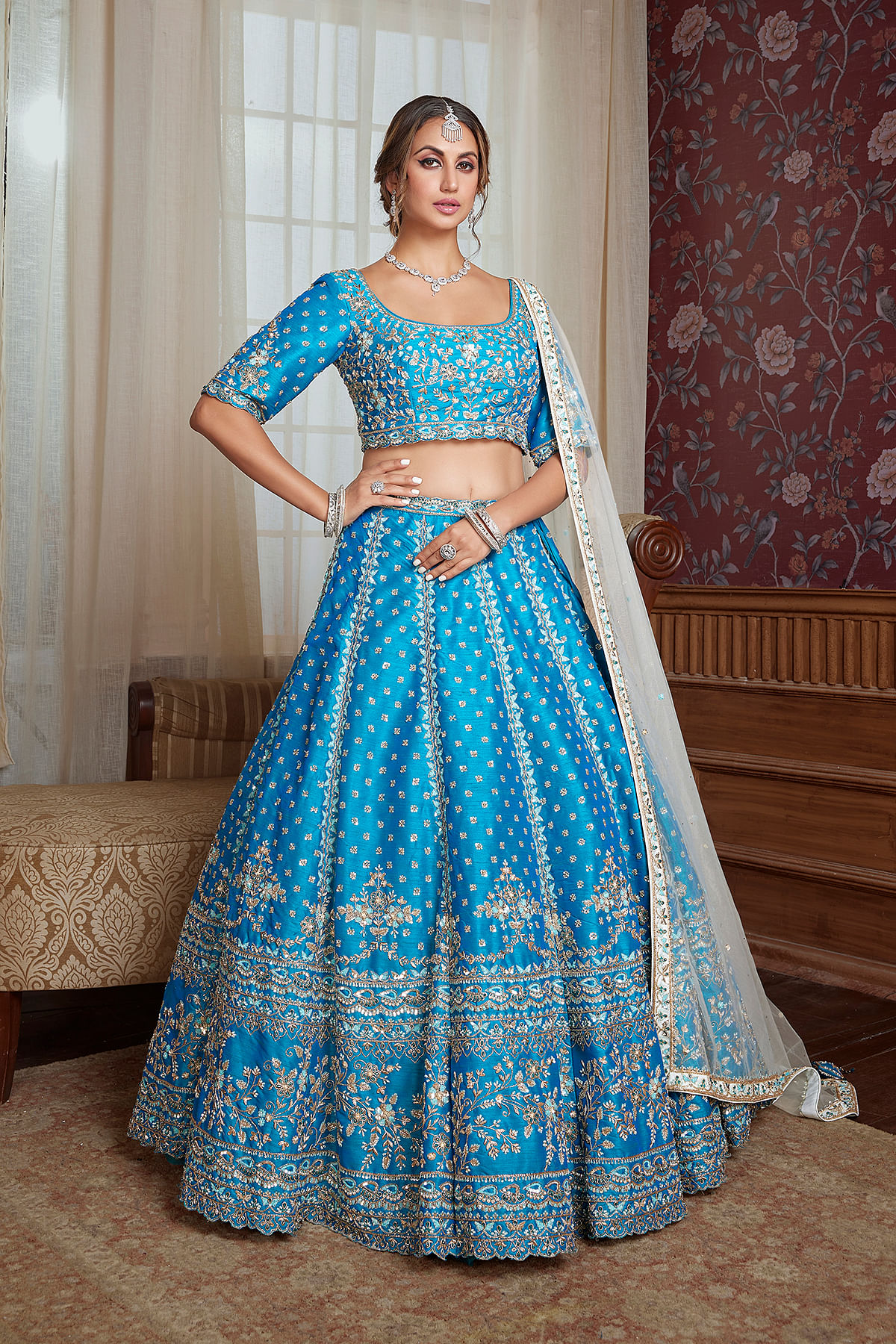 Buy Firozi Blue Umbrella Style Raw Silk Engagement Lehenga With Embroidered Squarish Round Neck Blouse Online at Samyakk