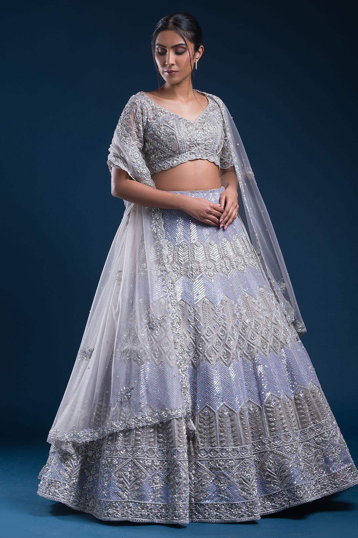 Pastel Grey Sequins Embroidered Net Reception Lehenga by Samyakk