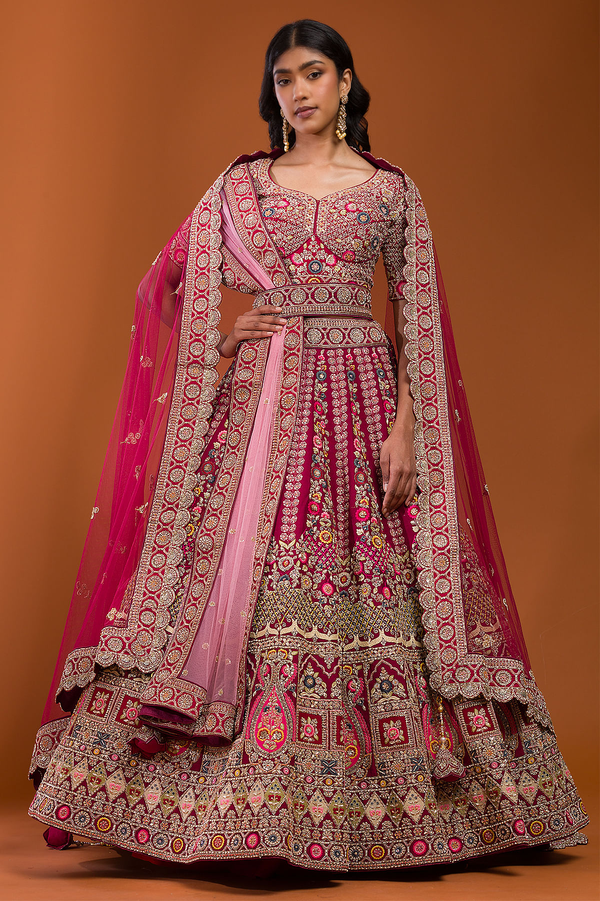 Blue Unstitched Net Lehenga features an intricate thread & stone  embroidered skirt, simple embroidered top & dupatta