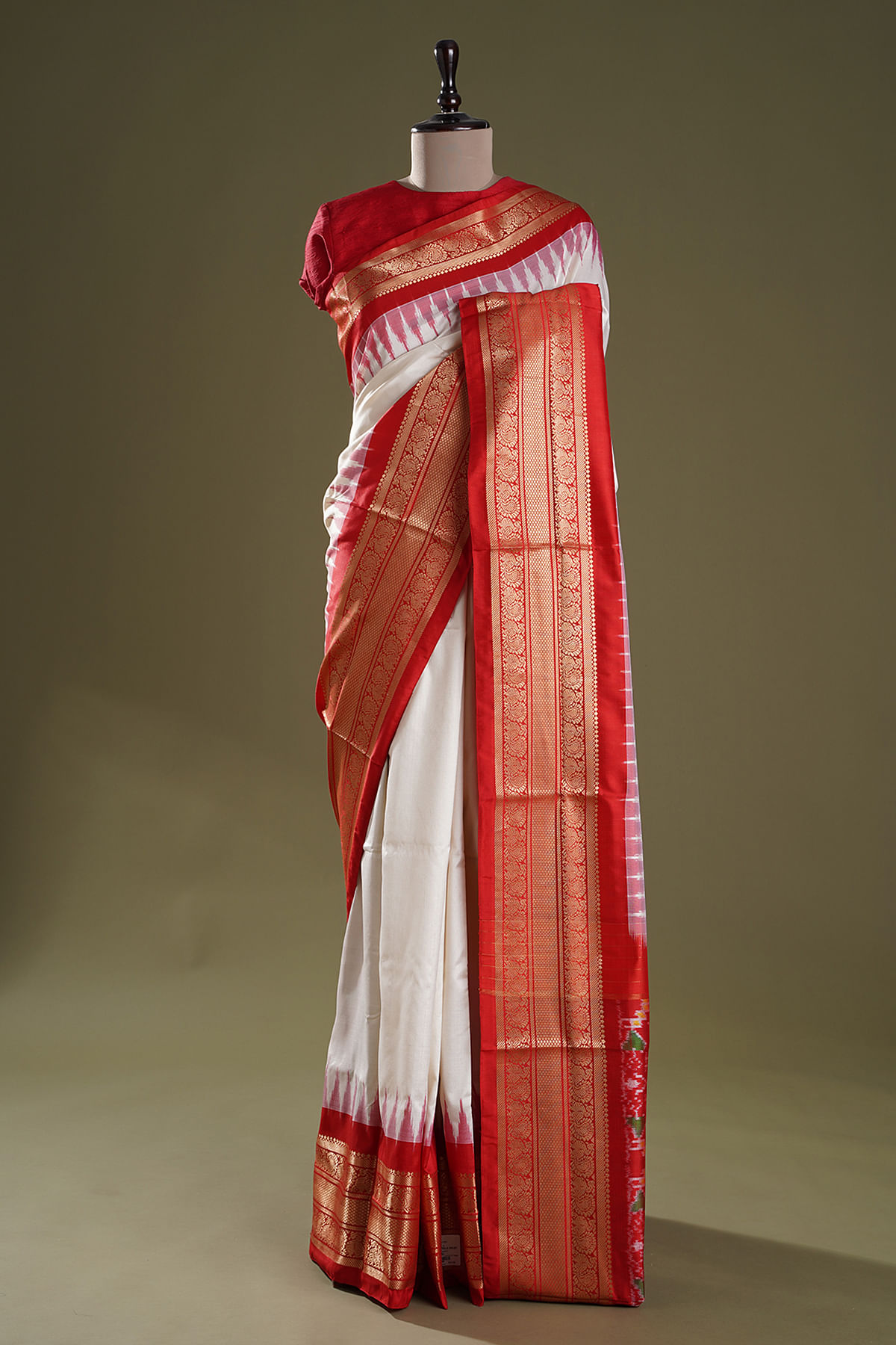 Dark jungle green Ikkat Saree features colorful ikkat-style designs,  contrast kanchi border & pallu with ikkat designs