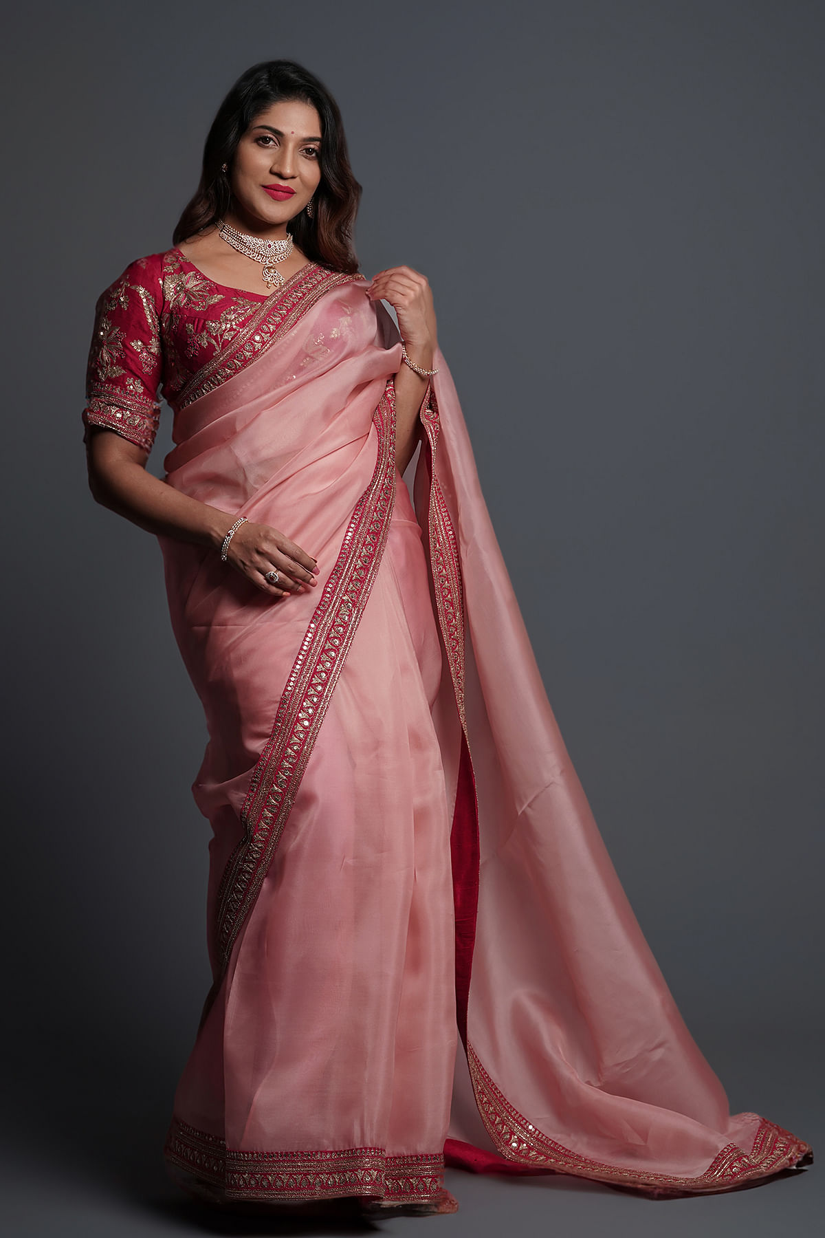 Embrace Glamour in Coral Pink Organza Saree with Sequins Embroidery