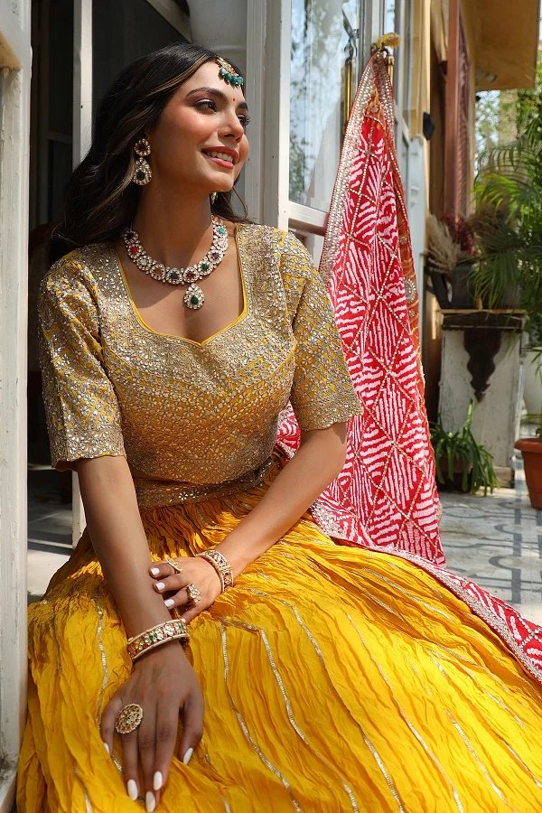 Look youthful in this colorful designer lehenga choli set featuring a red bandhani  lehenga and contrasting yellow … | Red lehenga choli, Red lehenga, Bandhani  dress